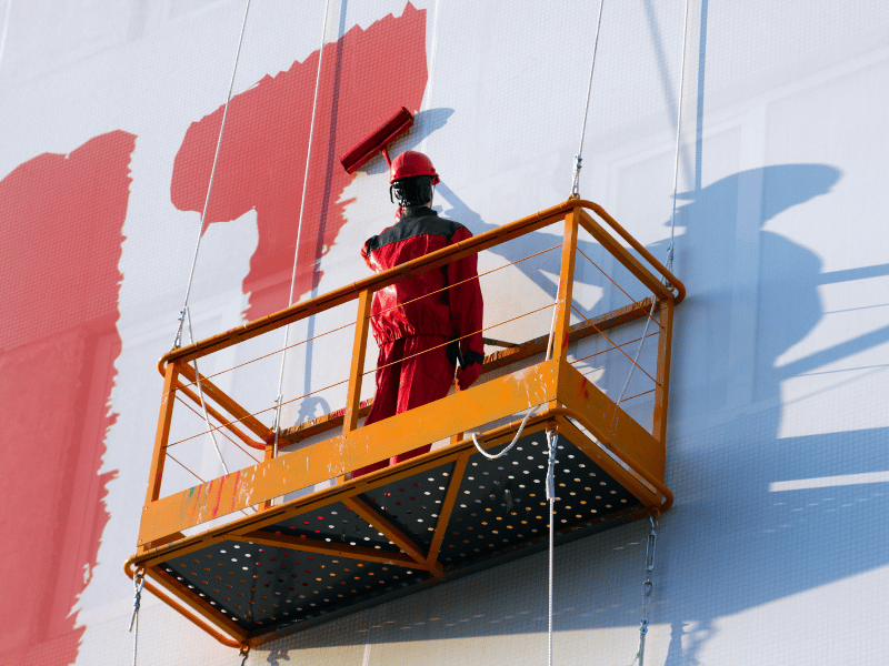 Commercial Painter on a Scaffold